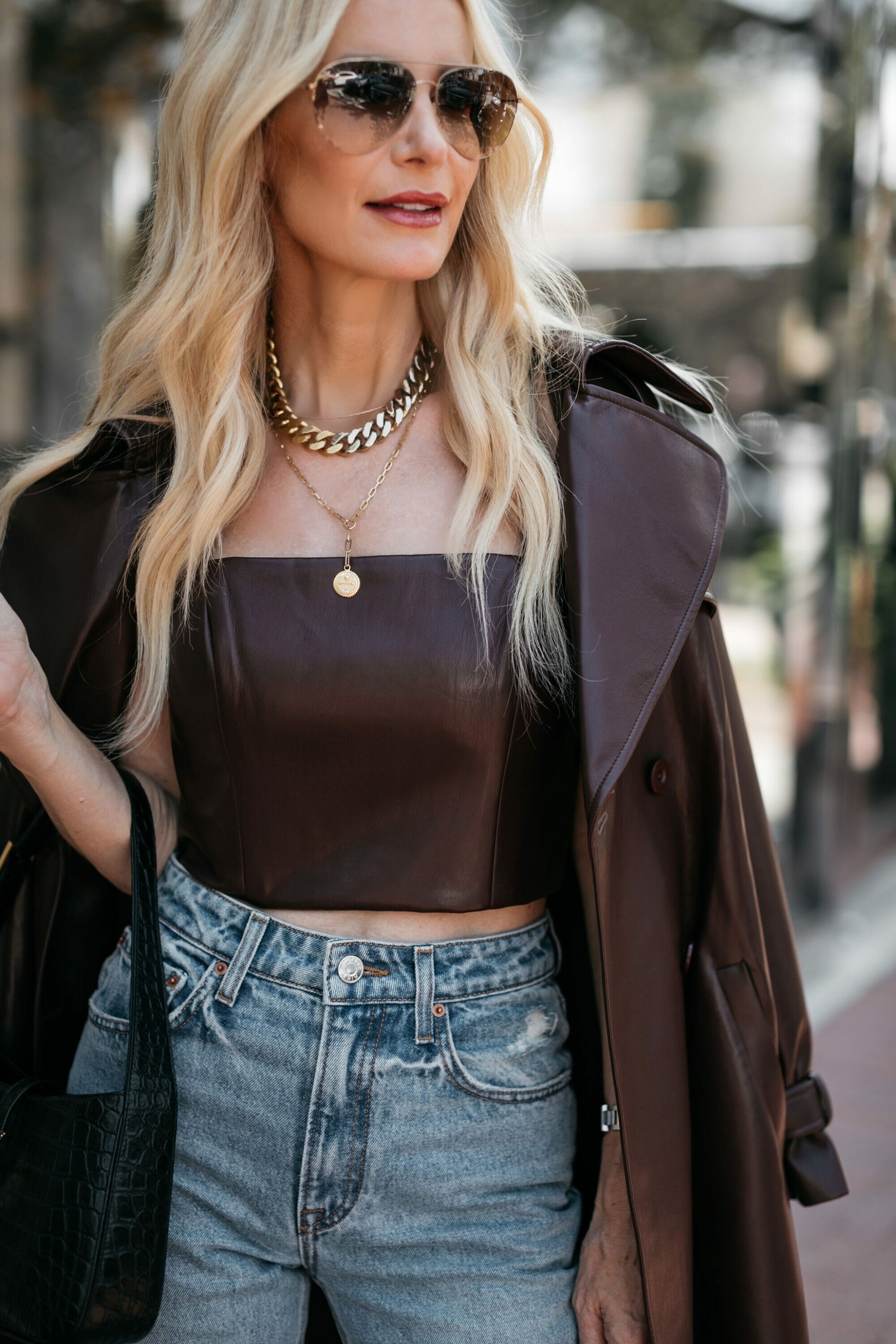 Over 40 fashion blogger wearing brown leather corset top and matching trench coat from Alice & Oliva and 2 items part of the Saks friends and family sale. 