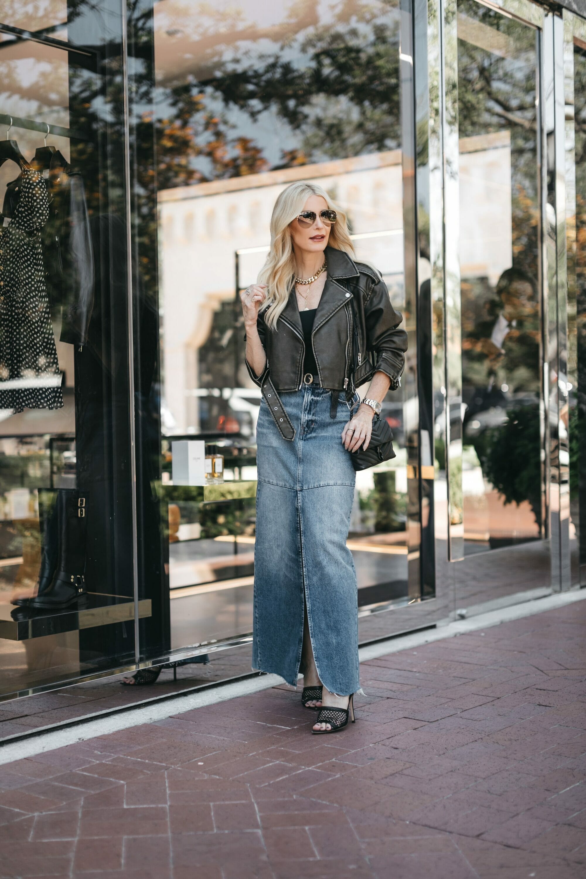 Over 40 Dallas fashion stylist wear reformation denim skirt with leather jacket and black bodysuit as one of August's top 5 best sellers.