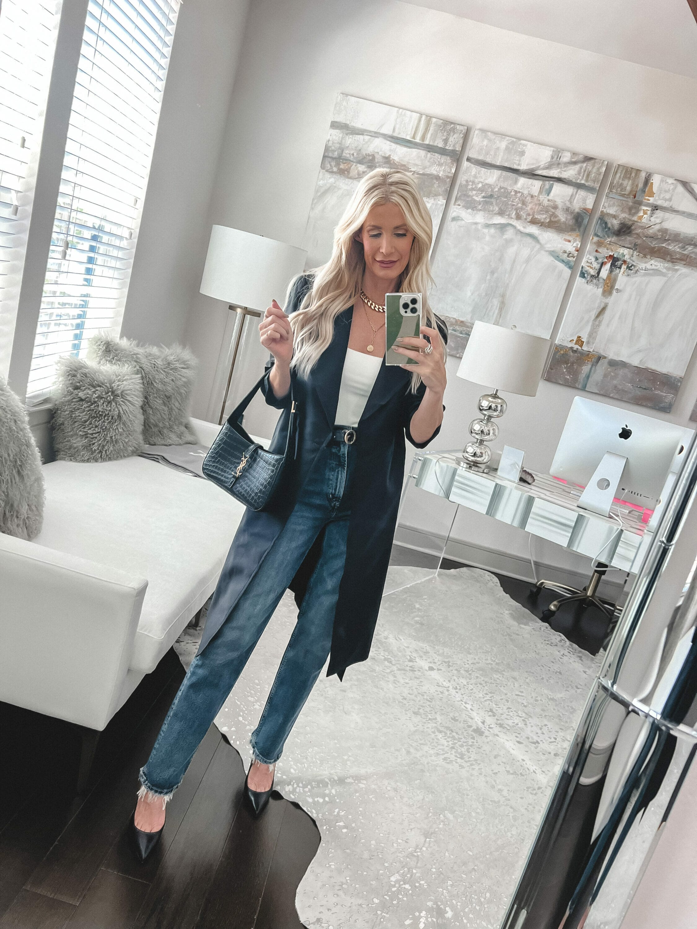 Over 40 fashion stylist from Dallas wearing a Lilysilk trench coat with a white bodysuit and denim as one of 8 style tips to look classy and elegant.