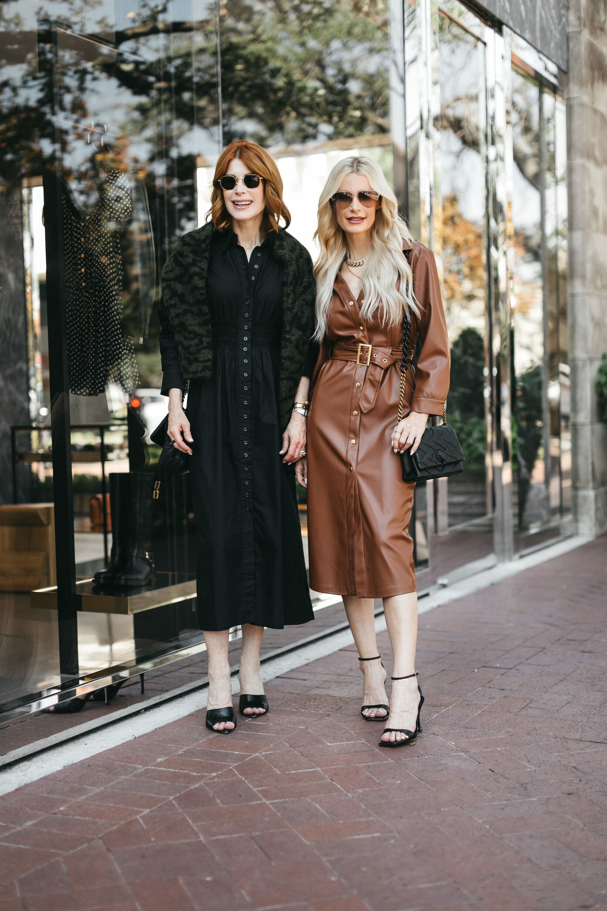 Over 40 fashion bloggers from Dallas wearing a brown leather dress and a black sweater dress as 2 fall dresses for every occasion.