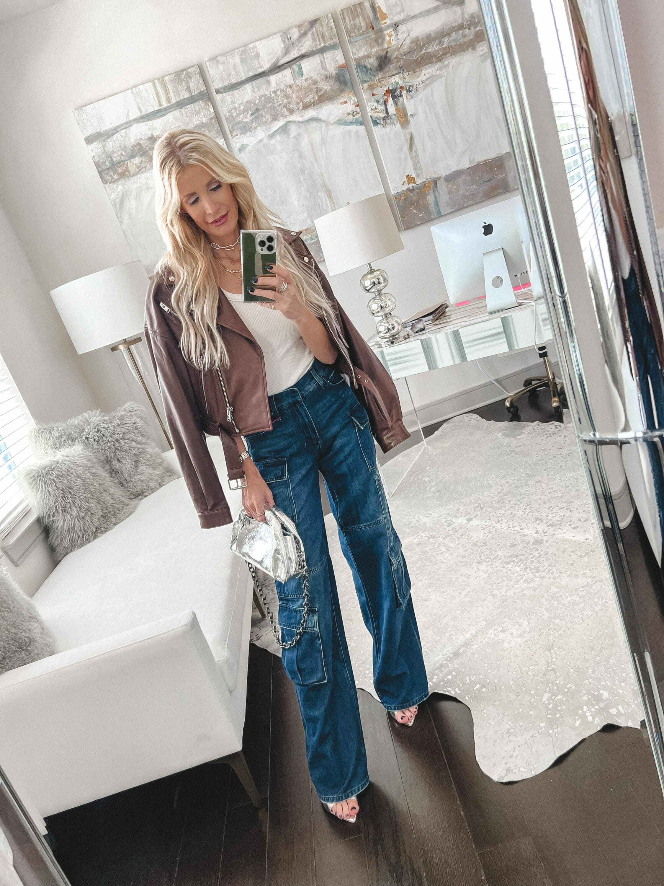 Dallas fashion blogger wearing cargo denim with a brown leather jacket and silver accessories as items part of the Saks friends and family sale.