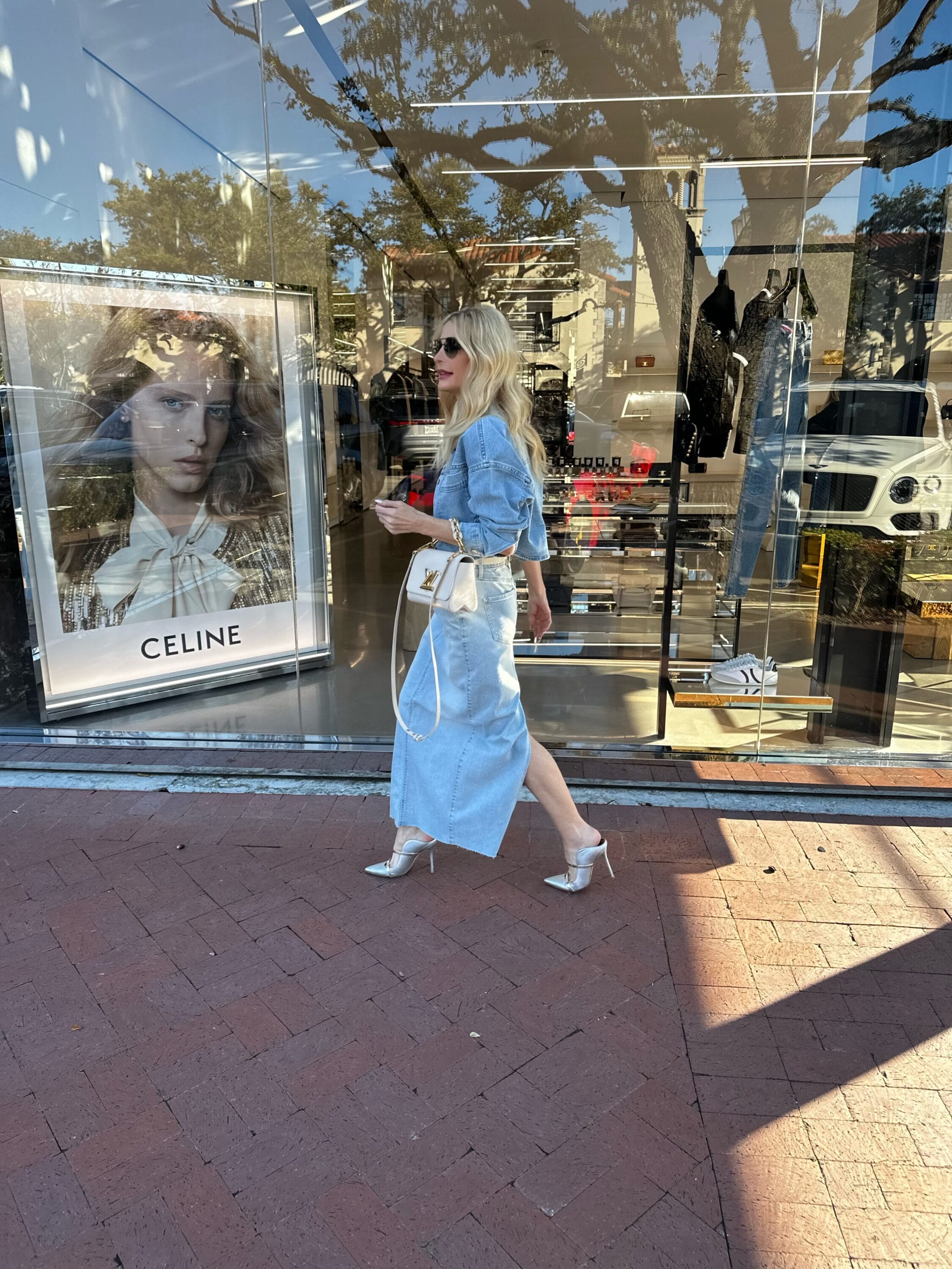 Dallas fashion influencer for women over 40 wearing a denim maxi skirt with a denim jacket that are both under $100.