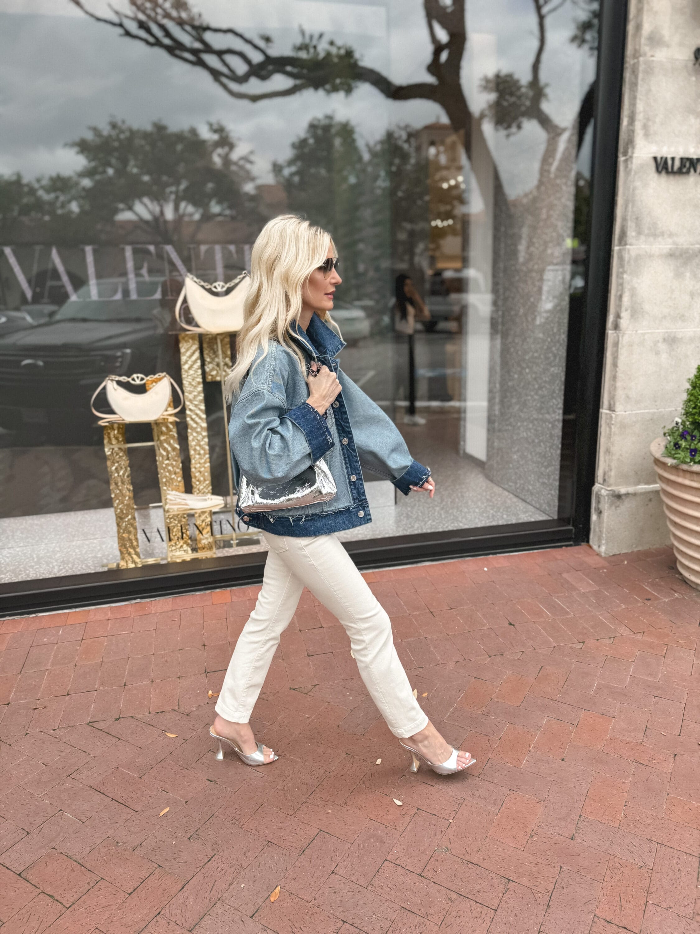Dallas fashion blogger wearing a two toned denim jacket with ivory denim as an example of one of the best spring jackets of 2024.