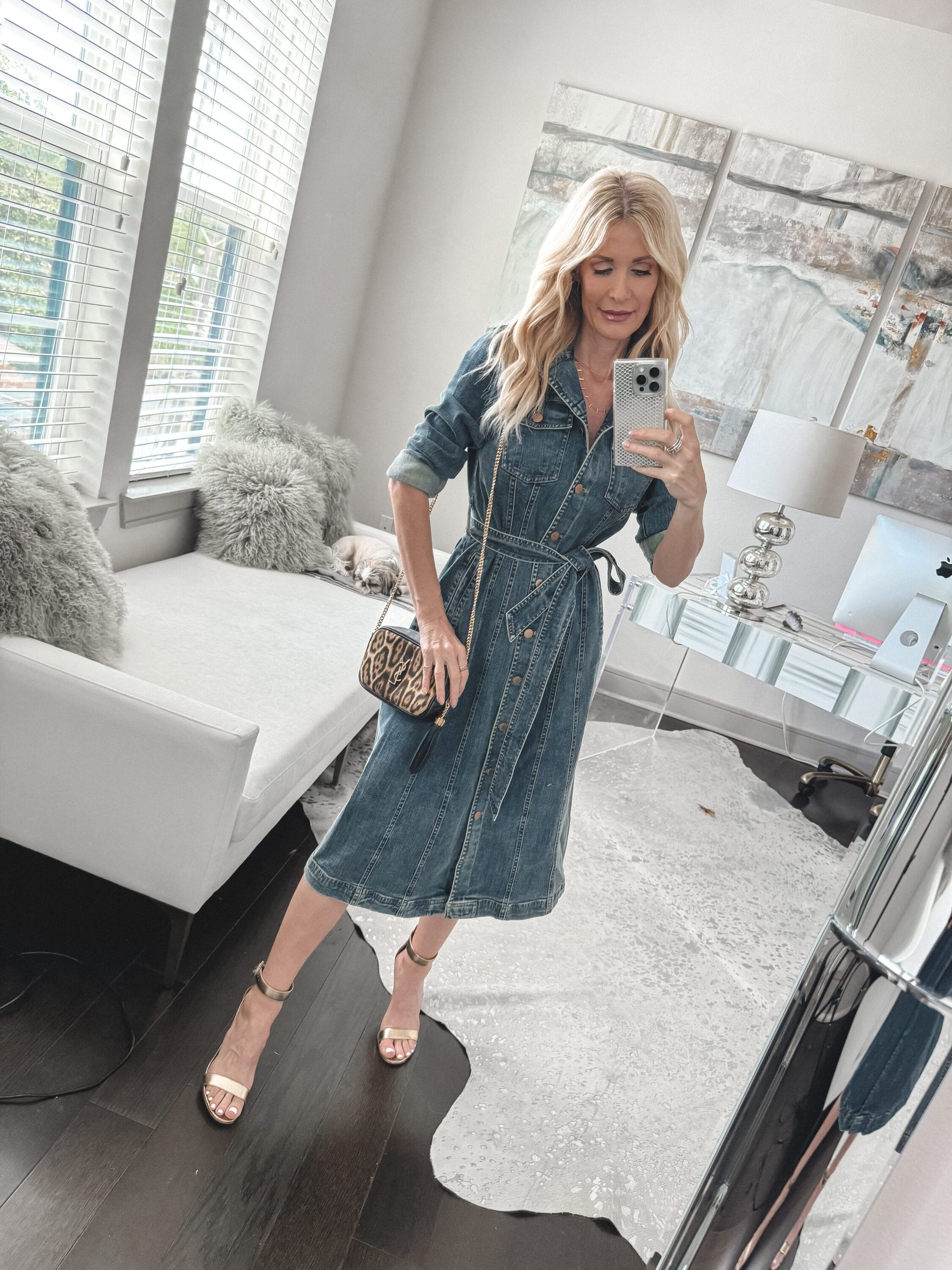 Dallas fashion influencer for women over 40 wearing a denim dress with gold heels as one of 5 stylish spring looks.