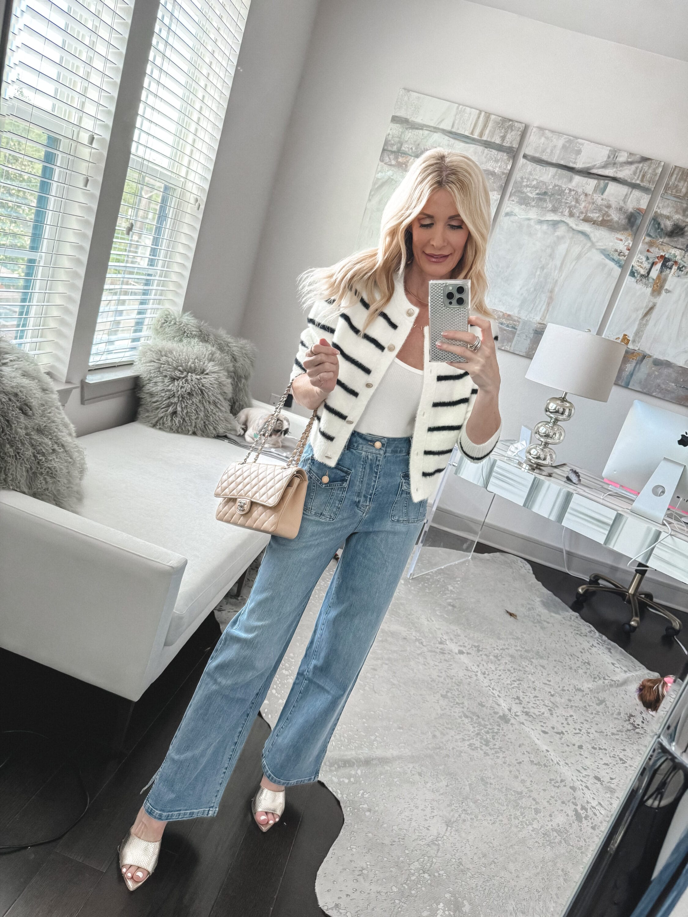 Over 40 fashion blogger wearing a striped cardigan with straight leg jeans and gold accessories as one of 5 stylish spring looks.