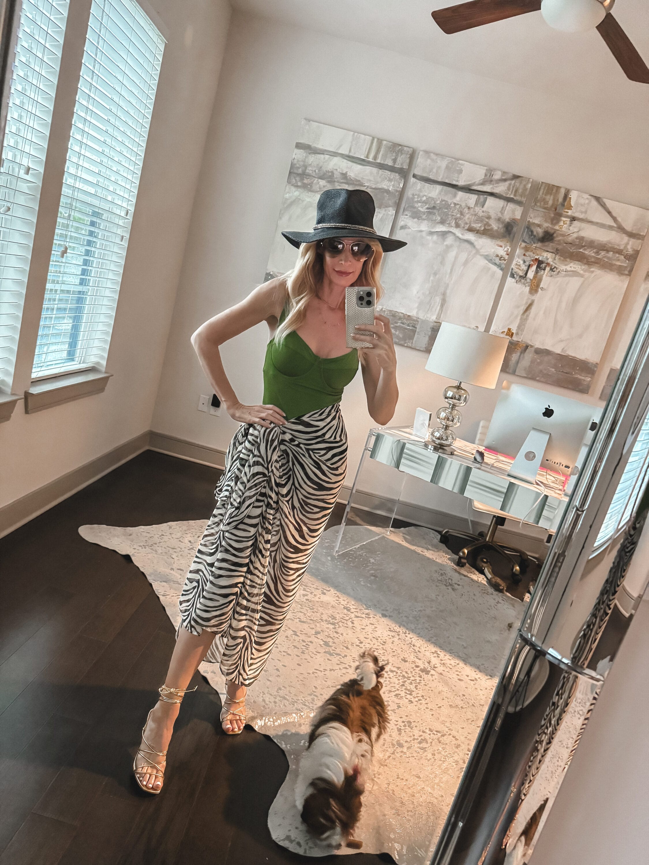 Dallas fashion influencer for women over 40 wearing a one piece bathing suit and a zebra sarong.